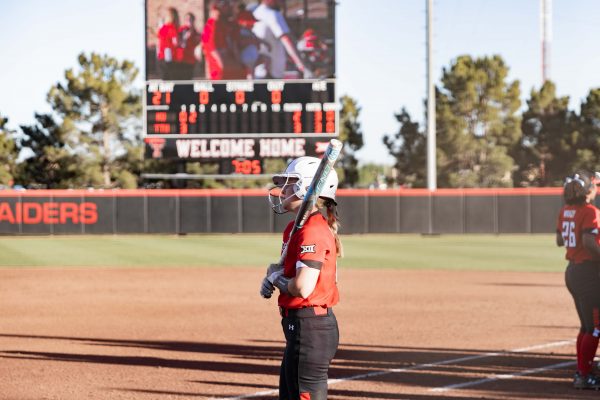 Redshirt junior OF Karli Hamilton warms up on deck after a delay during game two against Kansas at 6 p.m. on Friday, April 19, 2019 at Rocky Johnson Field. The Red Raiders tie the seres against the Jayhawks, 10-2 in five innings.