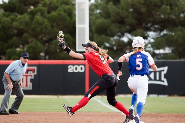 Senior Jessica Hartwell catches the ball to tag a University of Texas at Arlington runner at 3 p.m. on March 1, 2019, at Rocky Johnson Field. The No. 18 Lady Raiders defeated the Mavericks 9-1.