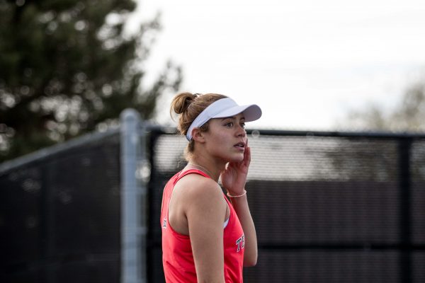 Senior singles player Lana Rush looks to her teammates during her match against West Virginia at 5 p.m. on March 15, 2019 at the Mcleod Tennis Center. The Lady Raiders defeat the Mountaineers 6-1 in the first Big 12 match of the season.